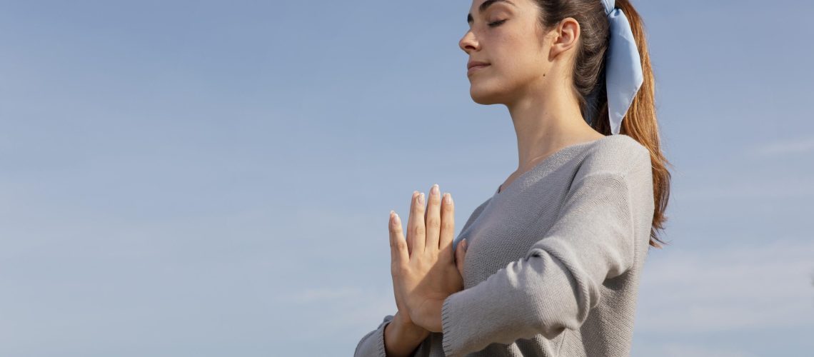 side-view-woman-meditating-nature